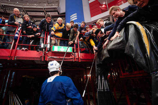 Nikita Kucherov of Tampa Bay Lightning gives away sticks