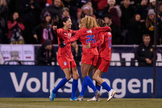 Christen Press, Casey Short and Tobin Heath of USA