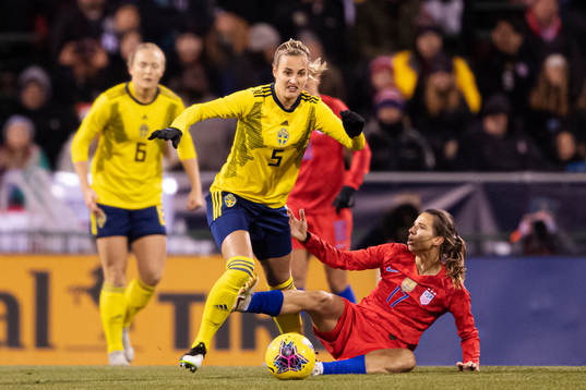 Nathalie Björn of Sweden and Tobin Heath of USA