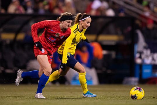 Andi Sullivan of USA and Kosovare Asllani of Sweden