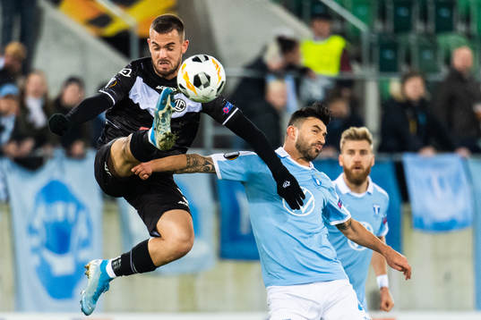 Filip Holender of Lugano and Behrang Safari of Malmö FF
