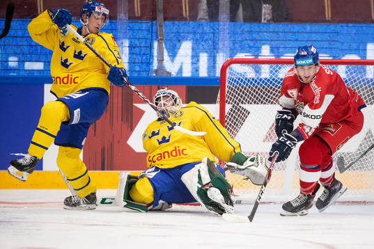Olle Alsing of Sweden and goaltender Adam Reideborn of