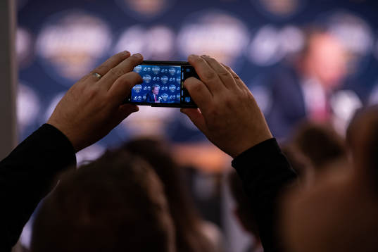 A man takes photos with phone