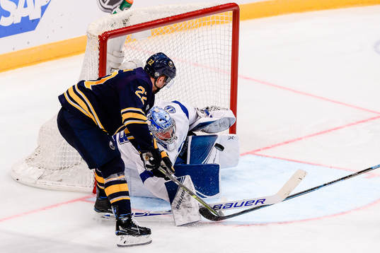 Johan Larsson of Buffalo Sabres and goalkeeper Andrei