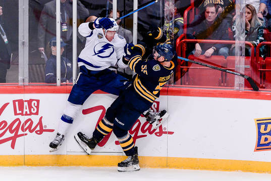 Rasmus Ristolainen of Buffalo Sabres hits Ondrej Palat of