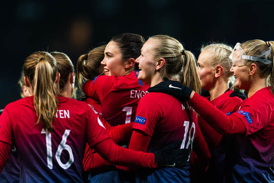 Ingrid Syrstad Engen of Norway celebrates with team mates