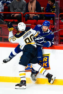 Marcus Johansson of Buffalo Sabres and Yanni Gourde of