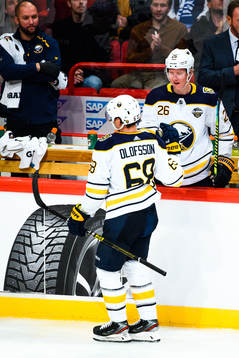 Victor Olofsson and Rasmus Dahlin of Buffalo Sabres