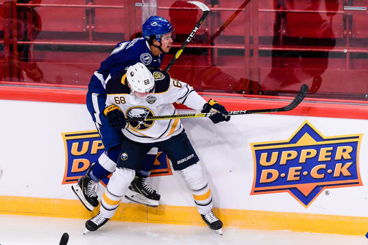 Victor Olofsson of Buffalo Sabres hits Mathieu Joseph of