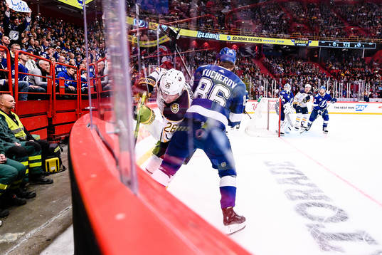 Nikita Kucherov of Tampa Bay Lightning hits Rasmus Dahlin
