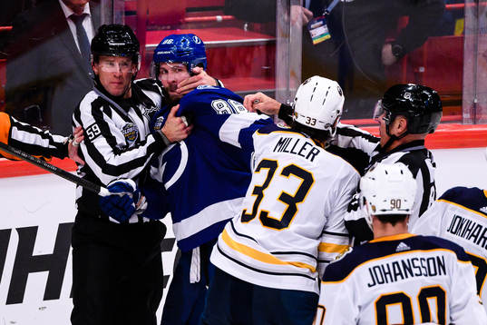 Nikita Kucherov of Tampa Bay Lightning fights Colin Miller