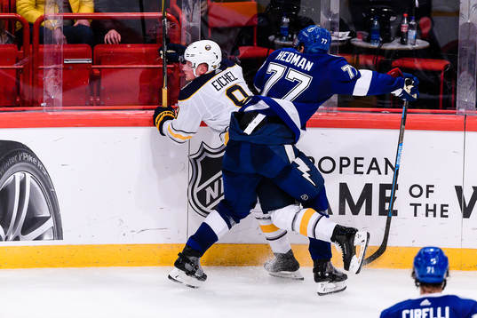Victor Hedman of Tampa Bay Lightning hits Jimmy Vesey of