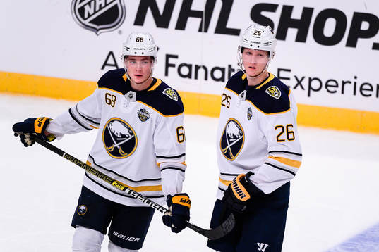 Victor Olofsson and Rasmus Dahlin of Buffalo Sabres