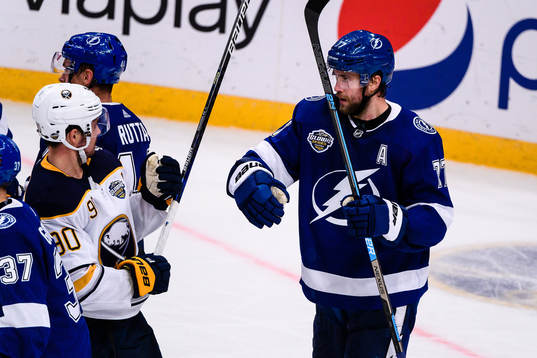 Marcus Johansson of Buffalo Sabres fights Victor Hedman of