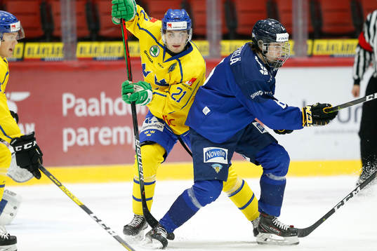 Nils Höglander #21, SWE and Topi Niemelä #6, FIN