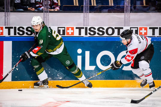 Linus Johansson of Färjestad and Karl Stollery of Frölunda
