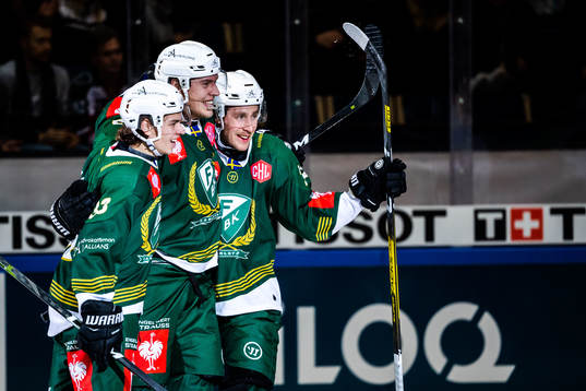 Victor Ejdsell of Färjestad celebrate with teammates