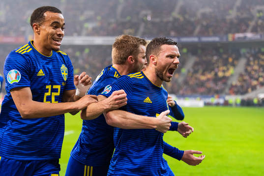 Robin Quaison and Sebastian Larsson celebrate with Marcus