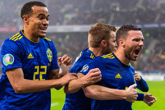 Robin Quaison and Sebastian Larsson celebrate with Marcus