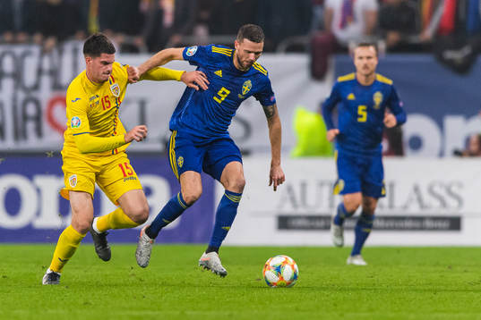 Tudor Baluta of Romania and Marcus Berg of Sweden compete
