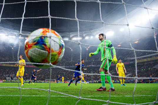 Robin Quaison of Sweden celebrates while goalkeeper Ciprian