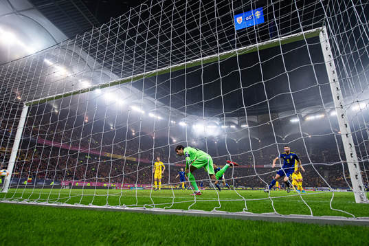 Marcus Berg of Sweden scores 0-1 behind goalkeeper Ciprian