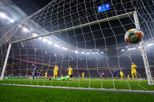 Robin Quaison of Sweden scores 0-2 behind goalkeeper