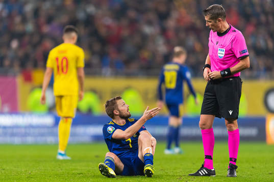 Sebastian Larsson of Sweden reacts against referee Daniele