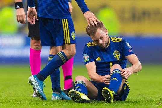 Sebastian Larsson of Sweden sits down injured