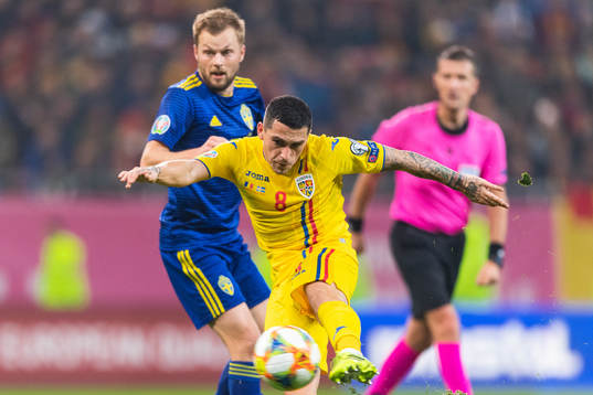 Sebastian Larsson of Sweden and Nicolae Stanciu of Romania