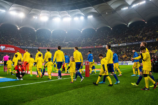 Players of Sweden enter the pitch