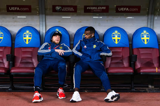 John Guidetti and Alexander Isak of Sweden sit