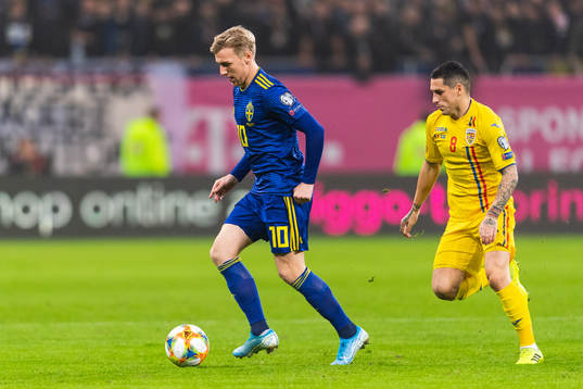 Emil Forsberg of Sweden and Nicolae Stanciu of Romania