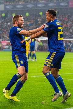 Sebastian Larsson and Robin Quaison of Sweden celebrate 0-2