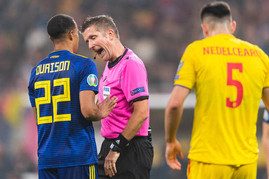 Robin Quaison of Sweden discuss with referee Daniele Orsato