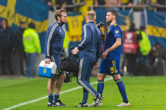 Marcus Berg of Sweden leaves the pitch due to injury