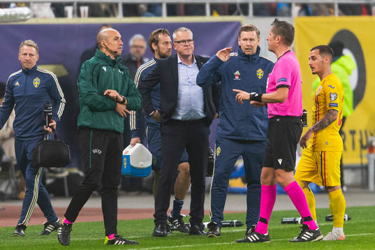 Fourth official Michael Fabri and referee Daniele Orsato in