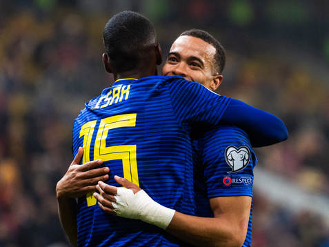Alexander Isak and Robin Quaison of Sweden hug as they