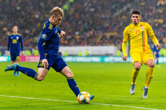 Emil Forsberg of Sweden and Florinel Coman of Romania