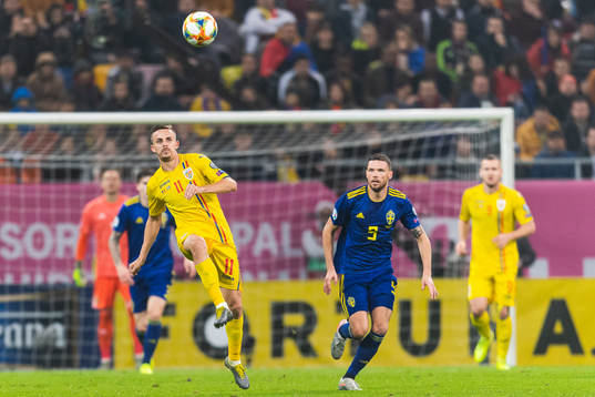 Nicusor Bancu of Romania and Marcus Berg of Sweden