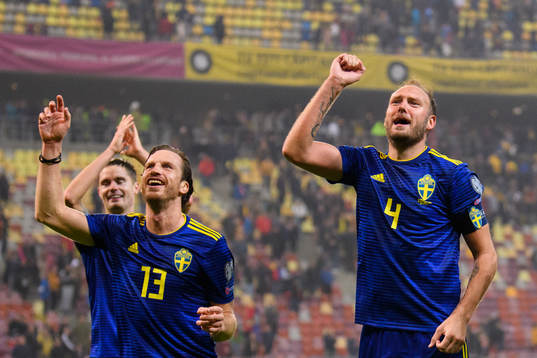 Gustav Svensson and Andreas Granqvist of Sweden celebrate