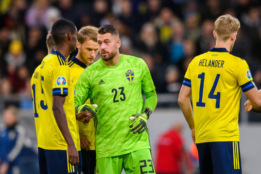 goalkeeper Kristoffer Nordfeldt and Alexander Isak of Sweden