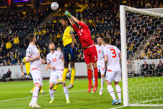 Alexander Isak of Sweden and goalkeeper Gunnar Nielsen of