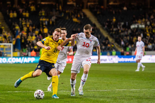 Dejan Kulusevski of Sweden and Solvi Vatnhamar of Faroe