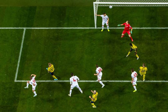 John Guidetti of Sweden scores 3-0 behind goalkeeper Gunnar