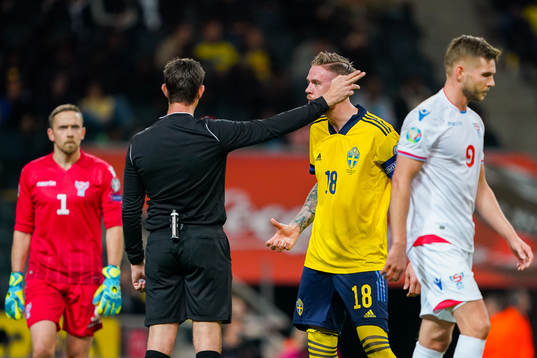 Pontus Jansson of Sweden reacts against referee Matej Jug