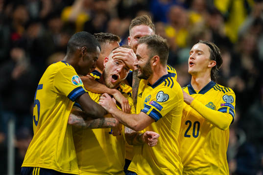 John Guidetti of Sweden celebrate with teammates