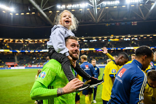 Goalkeeper Kristoffer Nordfeldt of Sweden with his daughter