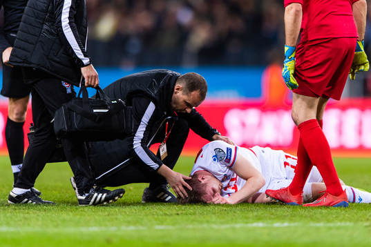 Medical staff attend to Klaemint Olsen of Faroe Islands due