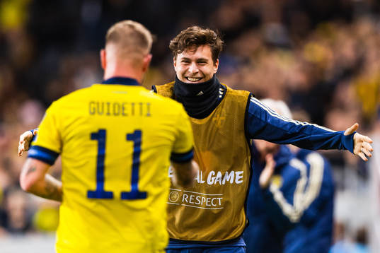 John Guidetti of Sweden celebrates scoring 3-0 and hugs